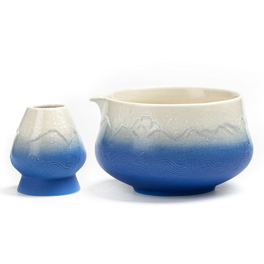 Ceramic teapot with gradient blue and white design on a white background