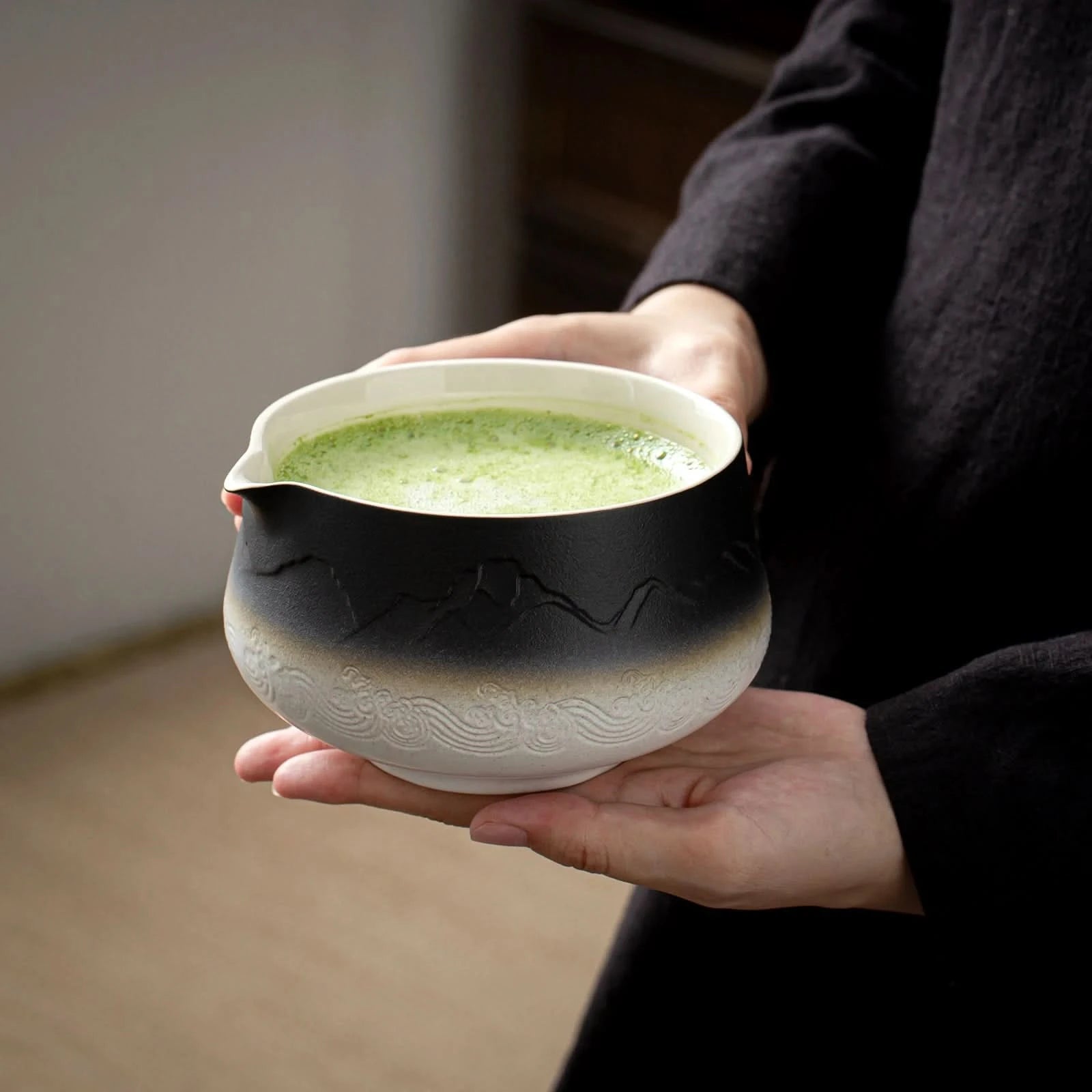 Ceramic matcha bowl full of Matcha tea